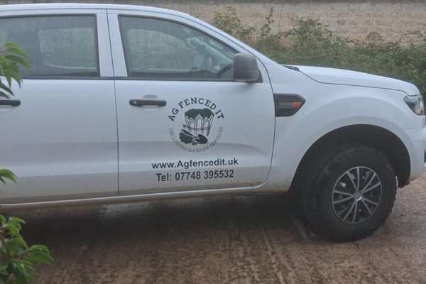 The AG Fenced It company standing in front of their van